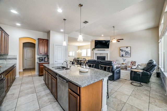 2023 Wilby Ln, San Antonio, TX 78253 - kitchen featuring dishwasher, a sink, a fireplace, ceiling fan, and open floor plan