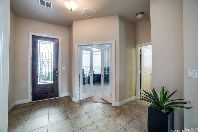 2023 Wilby Ln, San Antonio, TX 78253 - entrance foyer with light tile patterned floors, baseboards, and french doors