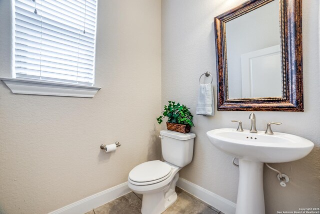 2023 Wilby Ln, San Antonio, TX 78253 - half bathroom featuring toilet, baseboards, and tile patterned floors