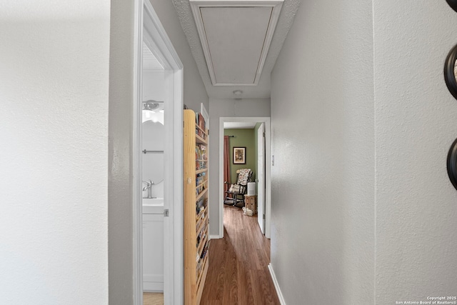 4303 Lakebend W, San Antonio, TX 78244 - hall featuring attic access, wood finished floors, and baseboards