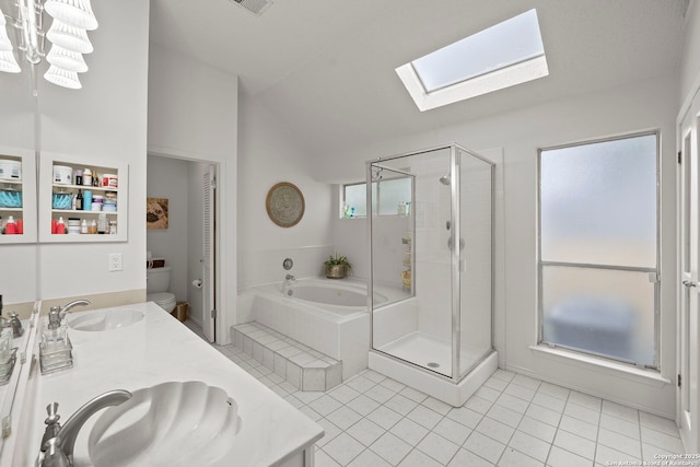 4303 Lakebend W, San Antonio, TX 78244 - full bathroom with a skylight, lofted ceiling, a garden tub, toilet, and double vanity