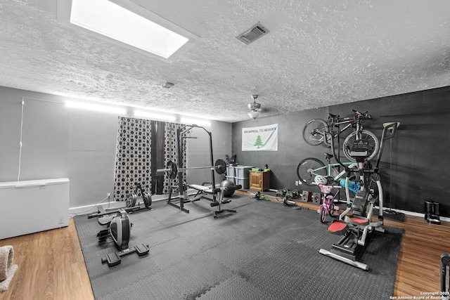 4303 Lakebend W, San Antonio, TX 78244 - workout area with a textured ceiling and wood finished floors
