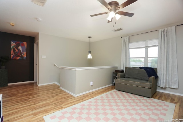 9011 Twincreek Farm, Converse, TX 78109 - sitting room featuring light wood-style flooring, baseboards, and a ceiling fan