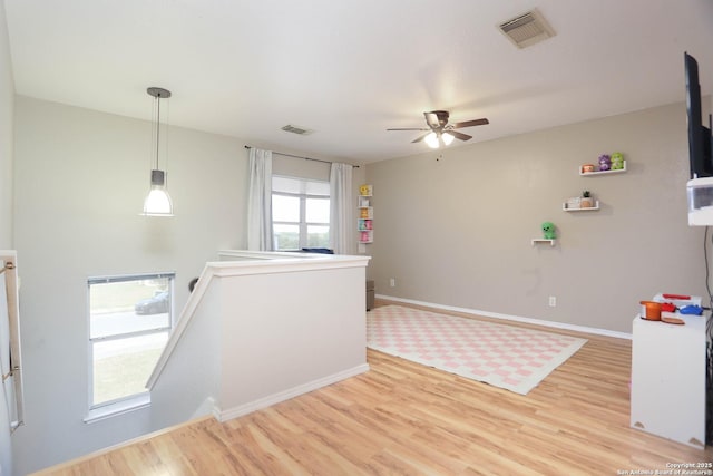 9011 Twincreek Farm, Converse, TX 78109 - unfurnished room with light wood-type flooring, ceiling fan, and baseboards