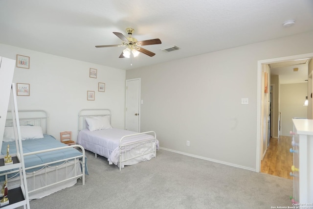 9011 Twincreek Farm, Converse, TX 78109 - bedroom with light colored carpet, a ceiling fan, and baseboards
