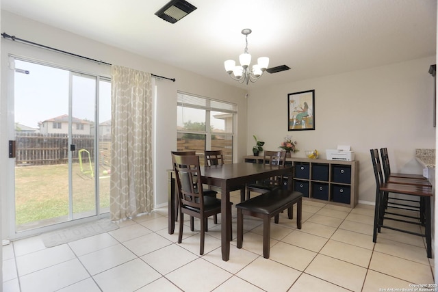 9011 Twincreek Farm, Converse, TX 78109 - dining area with a chandelier, baseboards, and light tile patterned floors