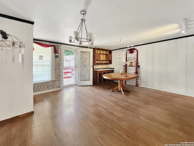 410 W Dickson, San Antonio, TX 78214 - dining area featuring wood finished floors and a chandelier