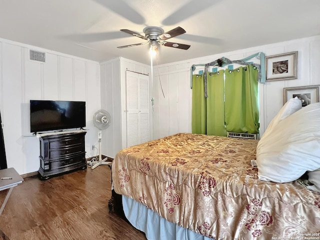 410 W Dickson, San Antonio, TX 78214 - bedroom featuring dark wood-style floors, ceiling fan, and a decorative wall