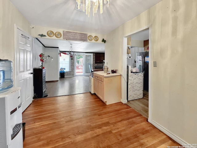 410 W Dickson, San Antonio, TX 78214 - kitchen with light wood-type flooring, light countertops, and baseboards