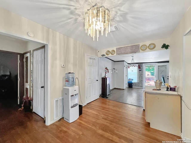 410 W Dickson, San Antonio, TX 78214 - kitchen with a chandelier, wood finished floors, and light countertops