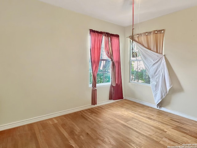 410 W Dickson, San Antonio, TX 78214 - unfurnished dining area featuring light wood-style floors and baseboards
