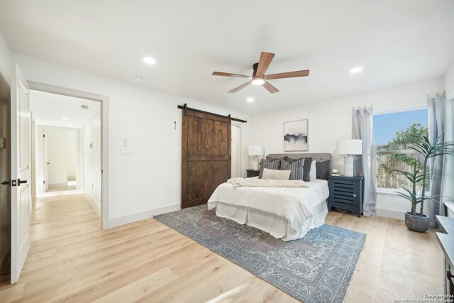 446 Forrest Hill, San Antonio, TX 78209 - bedroom featuring light wood-style flooring, a barn door, recessed lighting, baseboards, and a ceiling fan