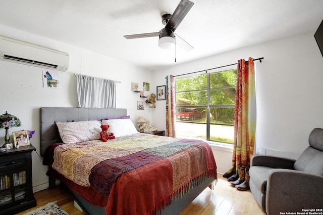 820 Kunkel, Seguin, TX 78155 - bedroom with a wall mounted air conditioner, wood finished floors, and ceiling fan