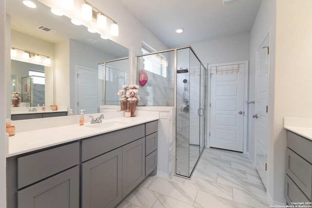 2617 River Pointe, San Antonio, TX 78245 - full bath with marble look tiles, vanity, a shower stall, and recessed lighting