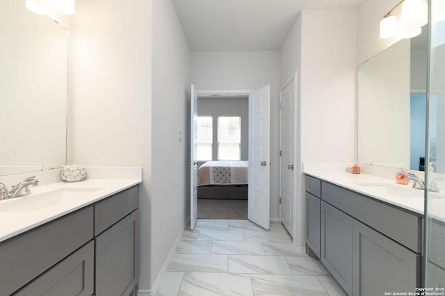 2617 River Pointe, San Antonio, TX 78245 - full bath featuring two vanities, marble finish floors, and baseboards