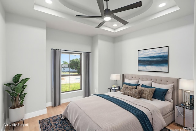 1475 Echo Mdw, Spring Branch, TX 78070 - bedroom with a raised ceiling, recessed lighting, light wood-style flooring, baseboards, and a ceiling fan
