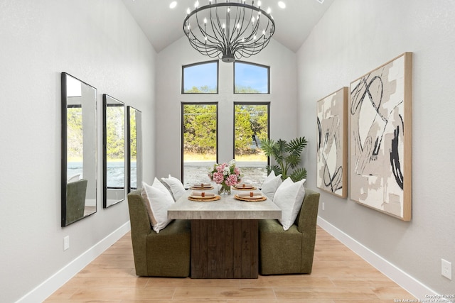 1475 Echo Mdw, Spring Branch, TX 78070 - dining room with a chandelier, healthy amount of natural light, light wood-type flooring, and high vaulted ceiling