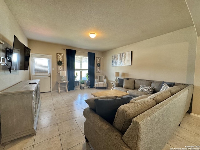 5726 Ivans Farm, San Antonio, TX 78244 - living area featuring light tile patterned flooring, a textured ceiling, and baseboards