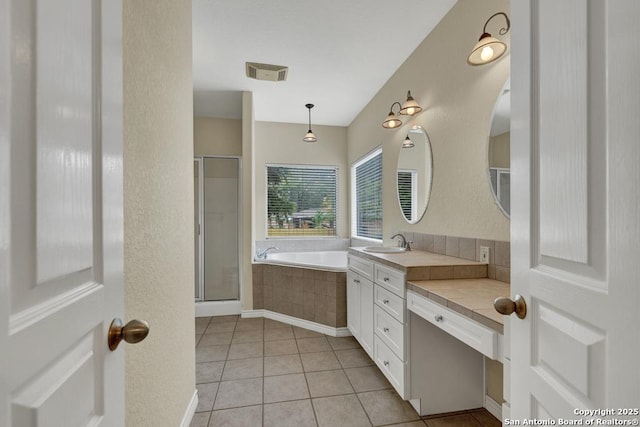 141 Rio Grande, Seguin, TX 78155 - bathroom featuring a garden tub, vanity, a stall shower, and tile patterned flooring