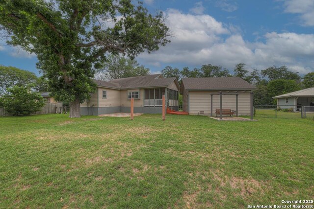 141 Rio Grande, Seguin, TX 78155 - rear view of property with a sunroom and a patio