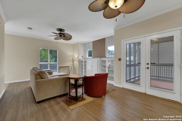 141 Rio Grande, Seguin, TX 78155 - living room featuring french doors, a ceiling fan, wood finished floors, crown molding, and baseboards