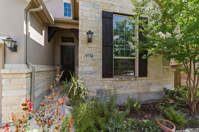 9730 Kremmen, Boerne, TX 78006 - doorway to property featuring stone siding and stucco siding