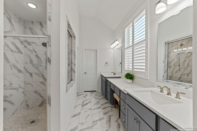 9730 Kremmen, Boerne, TX 78006 - bathroom featuring double vanity, a marble finish shower, vaulted ceiling, and marble finish flooring