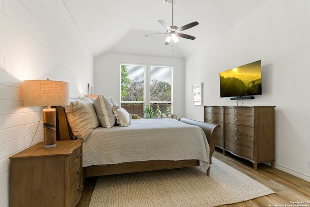 9730 Kremmen, Boerne, TX 78006 - bedroom featuring light wood-style flooring, vaulted ceiling, a ceiling fan, and baseboards
