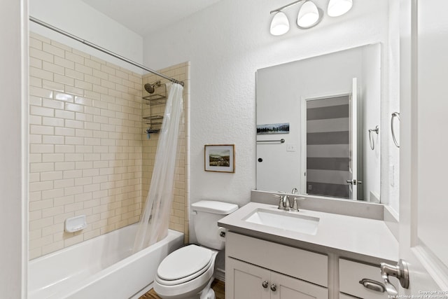 9730 Kremmen, Boerne, TX 78006 - full bathroom with vanity, toilet, shower / bath combo, and a textured wall