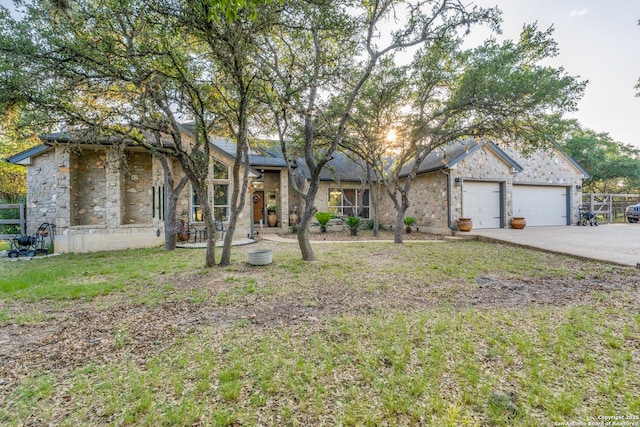 31763 Scarteen, Fair Oaks Ranch, TX 78015 - mid-century inspired home with stone siding, concrete driveway, and an attached garage
