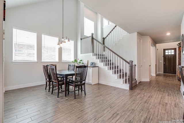 22806 Rio Salado, San Antonio, TX 78261 - dining space with a chandelier, light wood-style floors, stairway, healthy amount of natural light, and recessed lighting