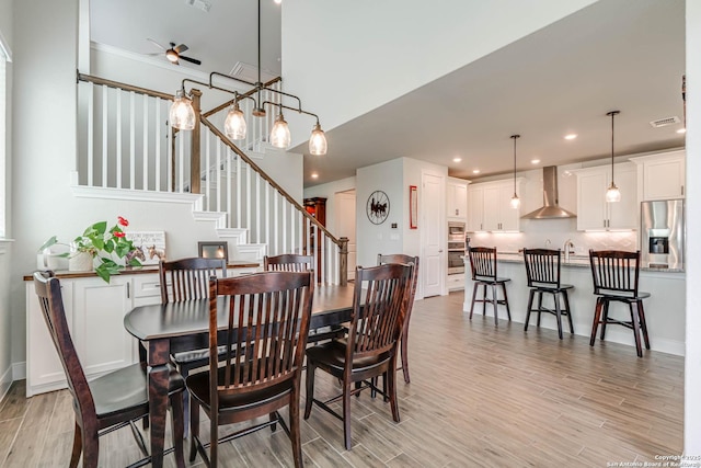 22806 Rio Salado, San Antonio, TX 78261 - dining area with a ceiling fan, light wood finished floors, stairs, and recessed lighting