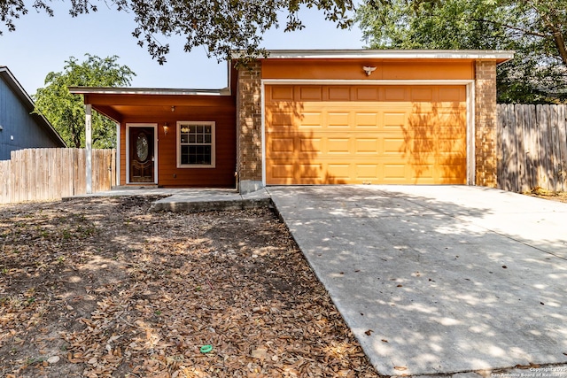 3613 Candleridge, San Antonio, TX 78244 - view of front of property with a garage and concrete driveway