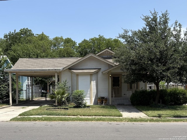 1927 Lee Hall, San Antonio, TX 78201 - view of front of home with an attached carport, driveway, and a front yard
