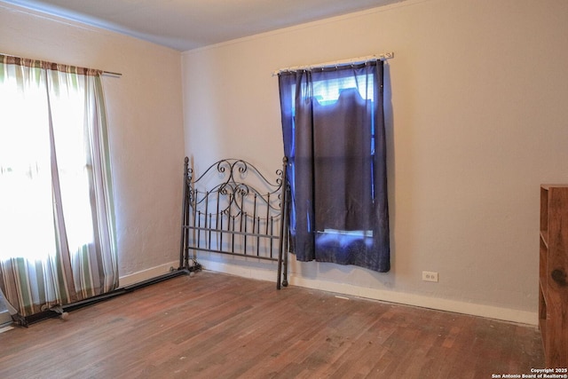 418 Cavalier, San Antonio, TX 78225 - empty room with wood finished floors, baseboards, and ornamental molding