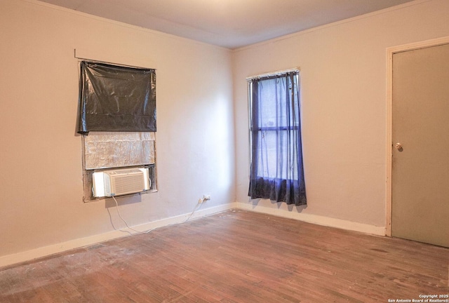 418 Cavalier, San Antonio, TX 78225 - empty room with wood finished floors, crown molding, baseboards, and cooling unit