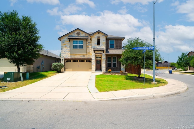 7207 Independence Way, San Antonio, TX 78223 - view of front of home featuring stone siding, a garage, driveway, a front yard, and a standing seam roof