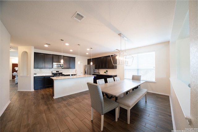 7207 Independence Way, San Antonio, TX 78223 - dining room with a chandelier, dark wood-style floors, recessed lighting, and baseboards