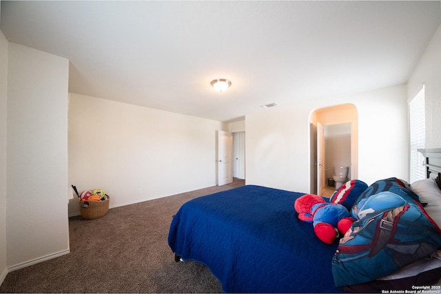 7207 Independence Way, San Antonio, TX 78223 - bedroom with carpet flooring and arched walkways