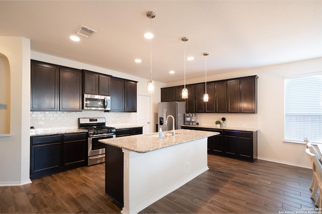 7207 Independence Way, San Antonio, TX 78223 - kitchen featuring stainless steel appliances, a sink, dark wood-type flooring, decorative backsplash, and recessed lighting