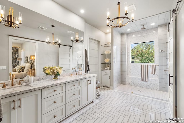 159 Inspiration, Fredericksburg, TX 78624 - bathroom with a chandelier, double vanity, tiled shower, toilet, and recessed lighting