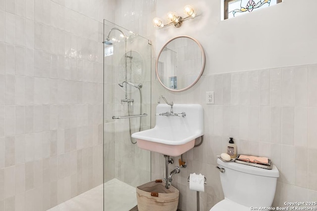 159 Inspiration, Fredericksburg, TX 78624 - full bath featuring tile walls, a walk in shower, a sink, and toilet