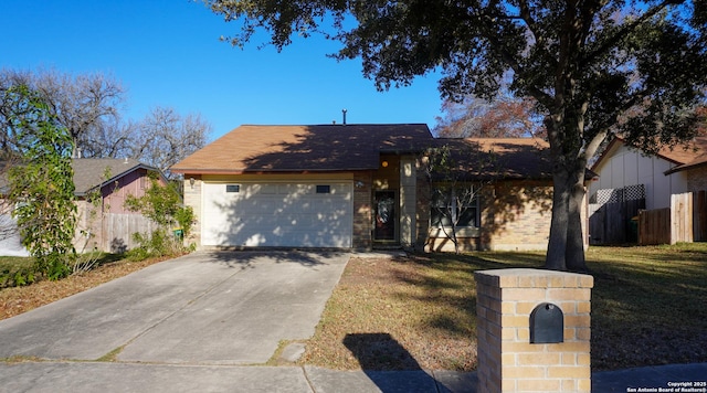 189 Meadowland, Universal City, TX 78148 - view of front facade featuring an attached garage, driveway, and brick siding