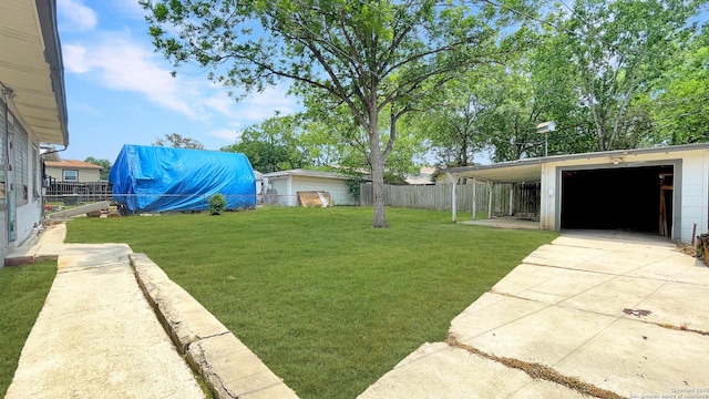 310 Merry Ann, San Antonio, TX 78223 - view of yard with driveway and an outdoor structure