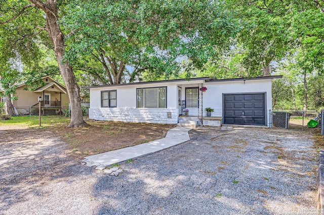 258 S Live Oak, New Braunfels, TX 78130 - view of front of house with a garage, driveway, and stucco siding