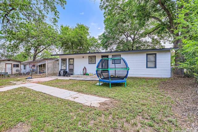 258 S Live Oak, New Braunfels, TX 78130 - back of house with a trampoline and a patio