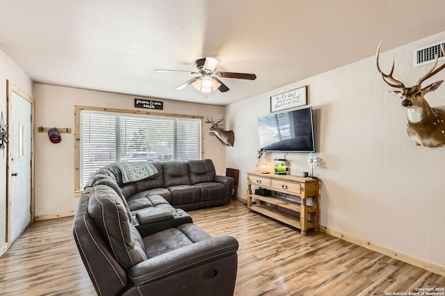 258 S Live Oak, New Braunfels, TX 78130 - living room with wood finished floors, ceiling fan, and baseboards