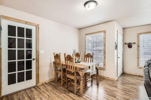 258 S Live Oak, New Braunfels, TX 78130 - dining area with light wood finished floors, healthy amount of natural light, and baseboards