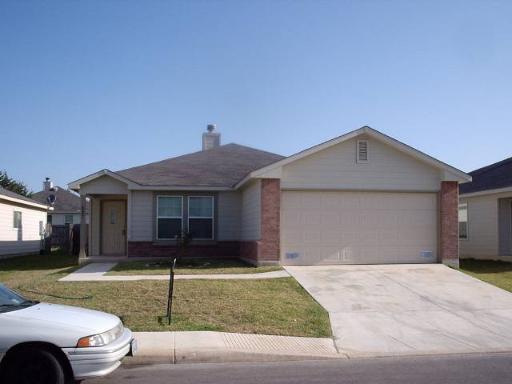 4007 Privet Pl, San Antonio, TX 78259 - ranch-style home with a garage, driveway, a front lawn, a chimney, and brick siding
