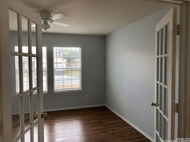 4007 Privet Pl, San Antonio, TX 78259 - spare room featuring french doors, dark wood-type flooring, ceiling fan, and baseboards